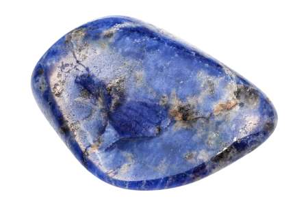 closeup of sample of natural mineral from geological collection - tumbled Sodalite gemstone isolated on white background